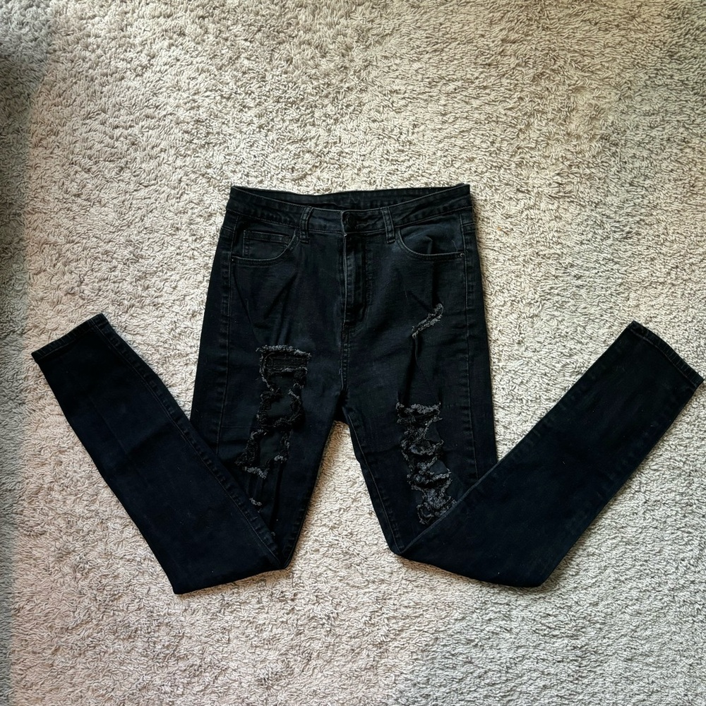 Women’s black distressed jeans